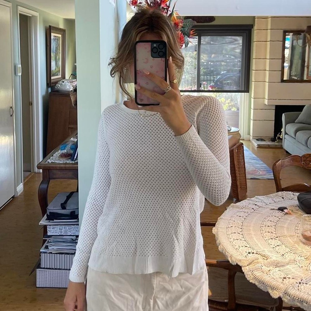 The white eyelet knit sweater